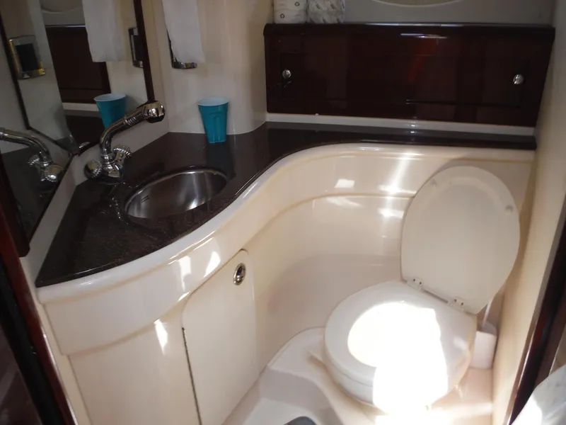 Slide: The Image of 2014 Meridian 441 Sedan bathroom with sink, toilet, and storage cabinets. - 17