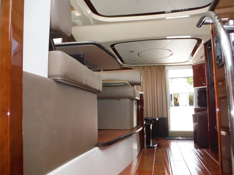 Slide: The Image of Interior of 2014 Meridian 441 Sedan yacht with luxurious seating and wooden flooring. - 19