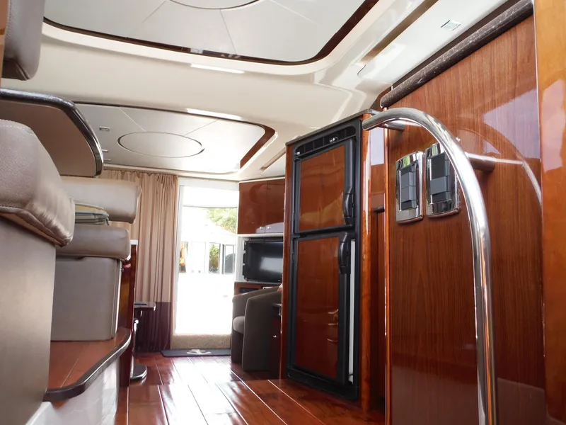 Slide: The Image of Interior of a 2014 Meridian 441 Sedan yacht with luxurious wood finishes. - 20