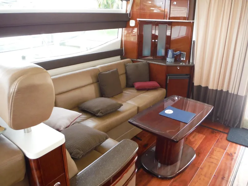 Slide: The Image of Luxurious interior of a 2014 Meridian 441 Sedan yacht with leather seating and wooden finishes. - 23
