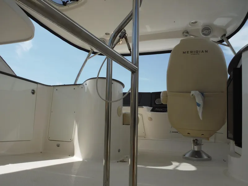 Slide: The Image of Interior of 2014 Meridian 441 Sedan yacht with captain's chair and sleek design. - 29