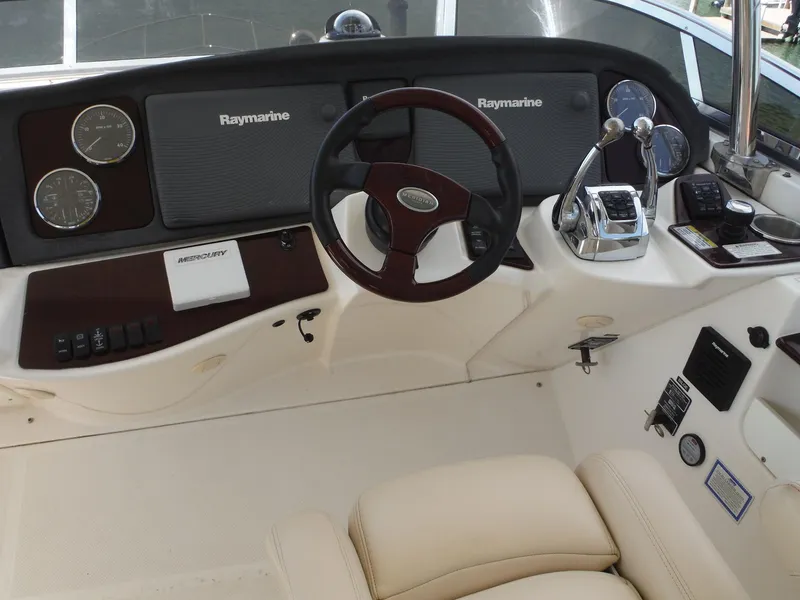 Slide: The Image of 2014 Meridian 441 Sedan helm with Raymarine electronics and leather seating. - 30