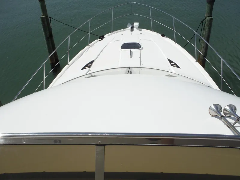 Slide: The Image of 2014 Meridian 441 Sedan yacht bow view at dock. - 35