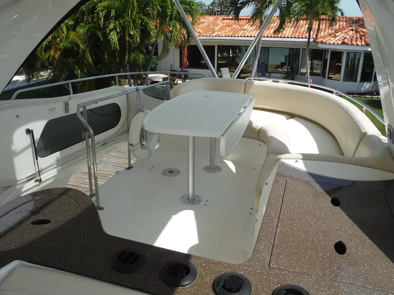 Slide: The Image of 2014 Meridian 441 Sedan yacht with outdoor seating and table. - 37