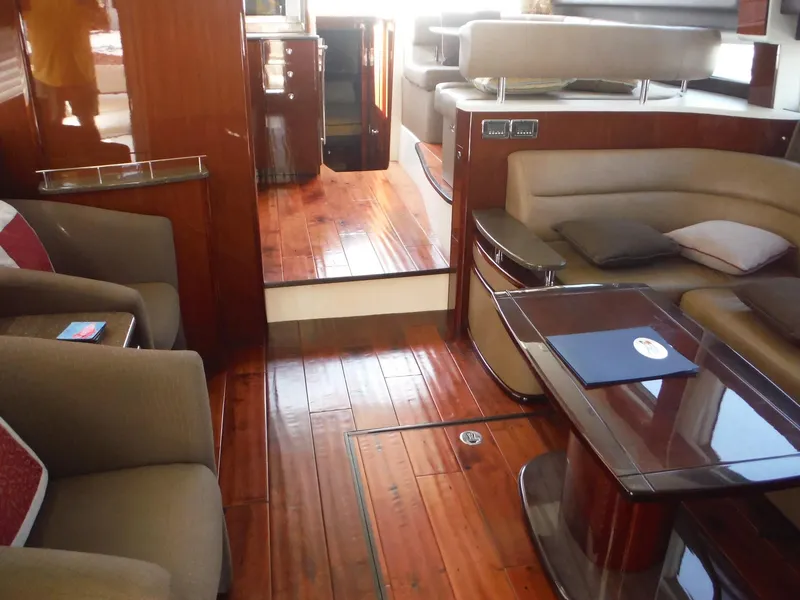 Slide: The Image of Luxurious interior of a 2014 Meridian 441 Sedan yacht with wooden flooring. - 46