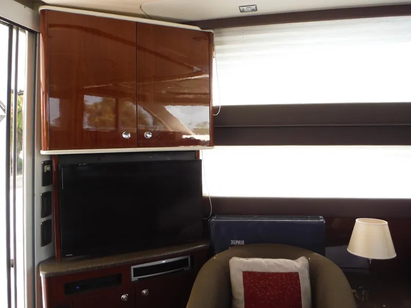 Slide: The Image of Interior of 2014 Meridian 441 Sedan with TV, cabinets, and seating area. - 47