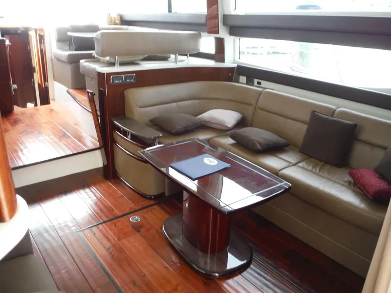 Slide: The Image of Luxurious interior of a 2014 Meridian 441 Sedan yacht with leather seating and wooden flooring. - 7