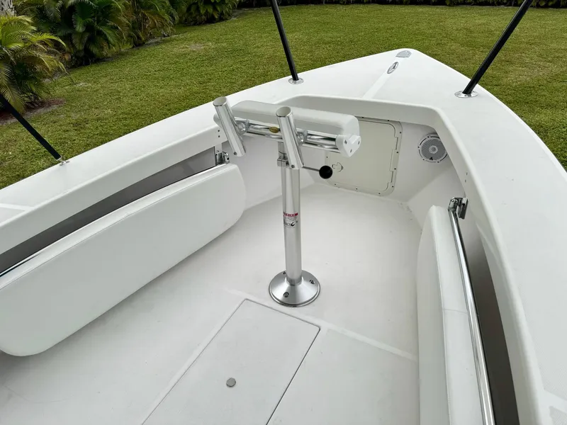 Slide: The Image of 2024 Rambo 22 Center Console boat interior with seating and rod holders. - 21