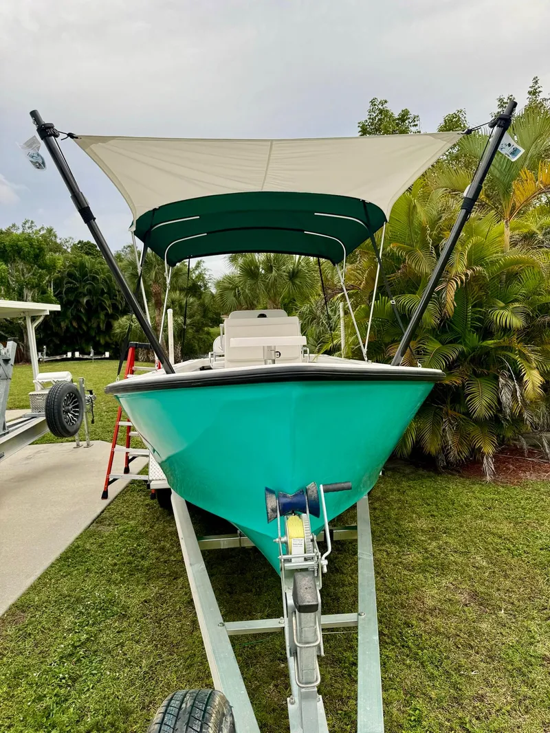 Slide: The Image of 2024 Rambo 22 Center Console boat with canopy on trailer. - 24