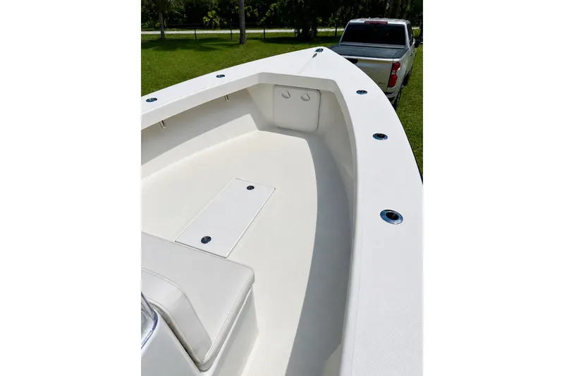 Slide: The Image of 2026 Rambo 22 Center Console boat interior with sleek white design and spacious seating. - 14