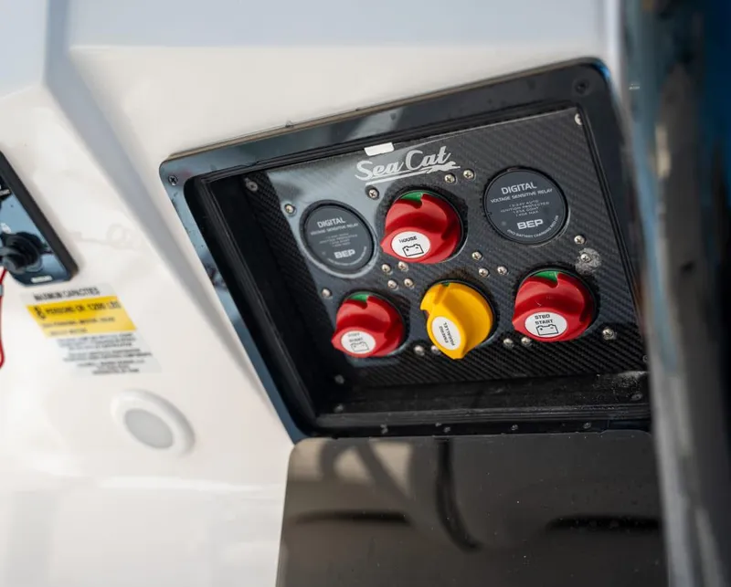 Slide: The Image of Control panel of 2025 Sea Cat 26 Hybrid Catamaran with switches and digital displays. - 3