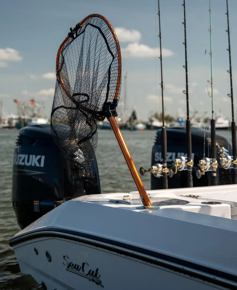 Slide: The Image of 2025 Sea Cat 26 Hybrid Catamaran with fishing gear and Suzuki outboard motors. - 4