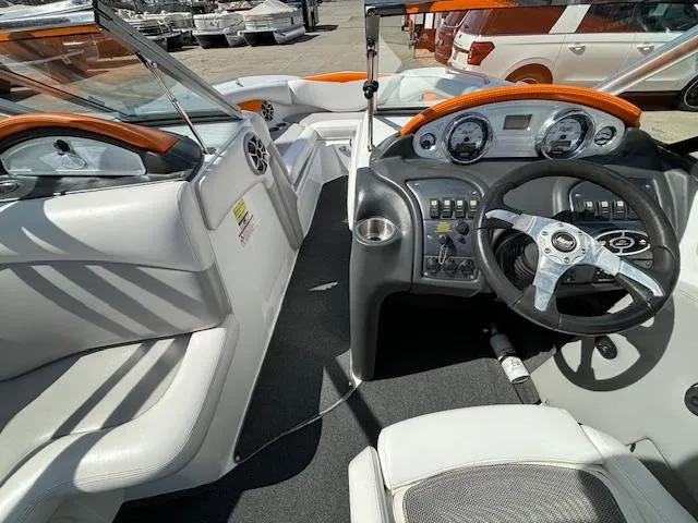 Slide: The Image of 2008 Tigé RZR 24 boat interior with steering wheel and dashboard. - 14
