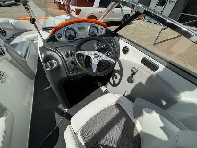 Slide: The Image of 2008 Tigé RZR 24 boat cockpit with steering wheel and dashboard controls. - 15