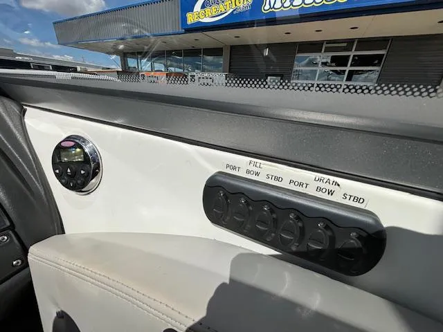 Slide: The Image of Control panel of a 2008 Tigé RZR 24 boat with fill and drain switches. - 16