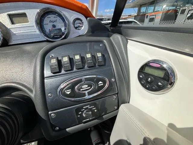 Slide: The Image of 2008 Tigé RZR 24 boat dashboard with gauges and control switches. - 17