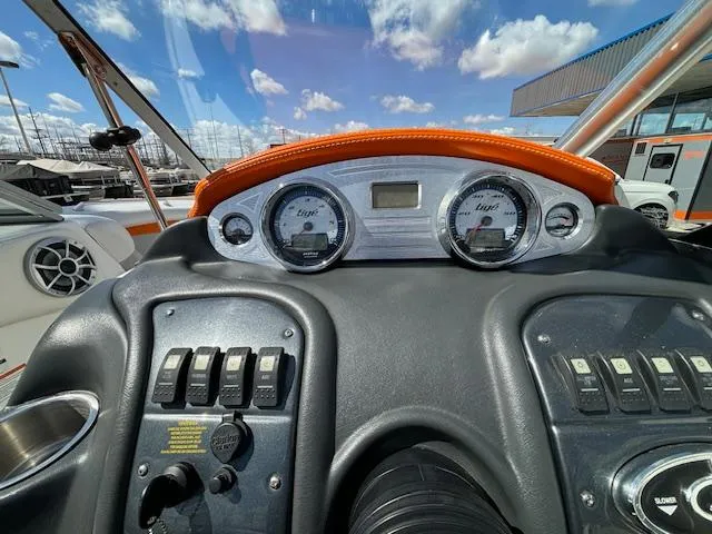 Slide: The Image of Dashboard of a 2008 Tigé RZR 24 boat with gauges and controls. - 18