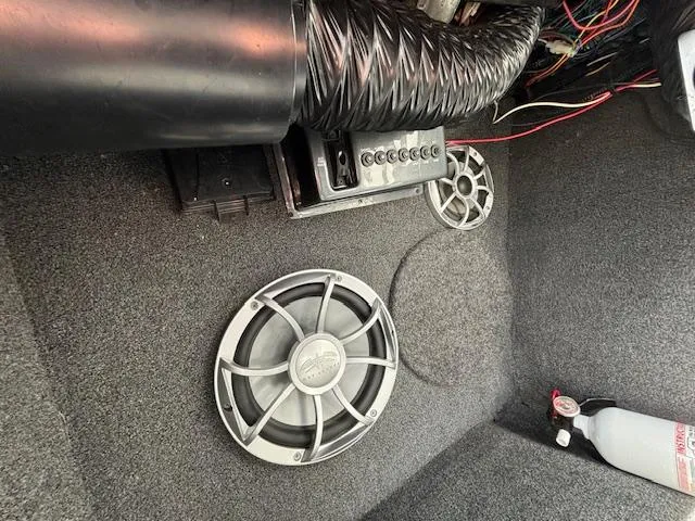 Slide: The Image of 2008 Tigé RZR 24 boat interior with speakers and fire extinguisher. - 20