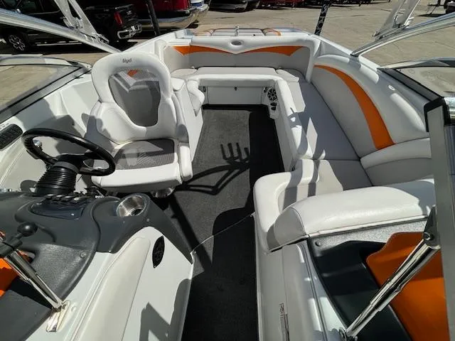 Slide: The Image of 2008 Tigé RZR 24 boat interior with white and orange seating. - 28