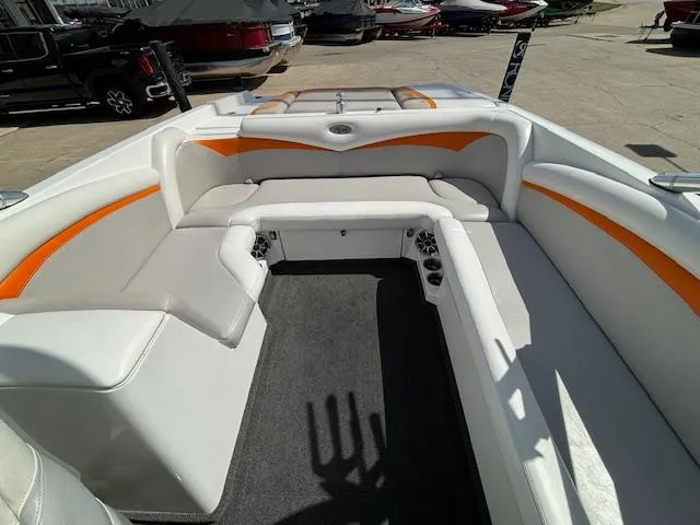 Slide: The Image of 2008 Tigé RZR 24 boat interior with white and orange seating. - 30