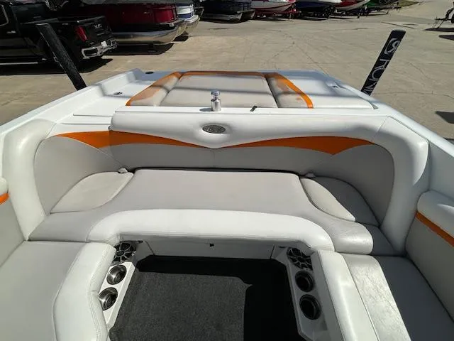 Slide: The Image of 2008 Tigé RZR 24 boat interior with white and orange seating. - 31