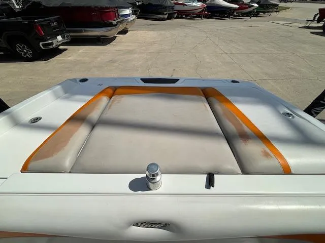 Slide: The Image of 2008 Tigé RZR 24 boat rear deck with orange and white upholstery. - 32