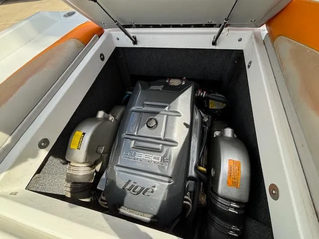 Slide: The Image of 2008 Tigé RZR 24 boat engine compartment with open hatch. - 34