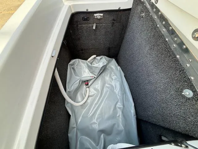 Slide: The Image of Storage compartment of 2008 Tigé RZR 24 boat with ballast bag. - 36