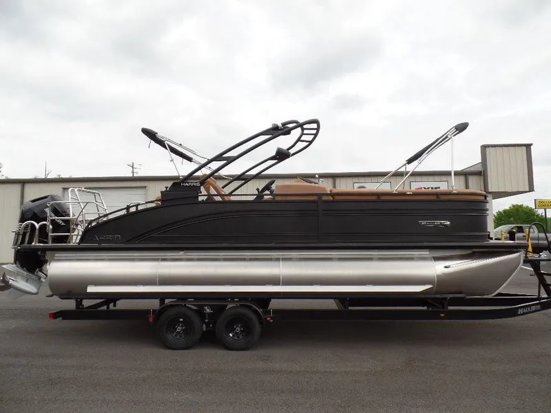 Slide: The Image of 2024 Harris Solstice 250 pontoon boat on trailer, side view. - 1