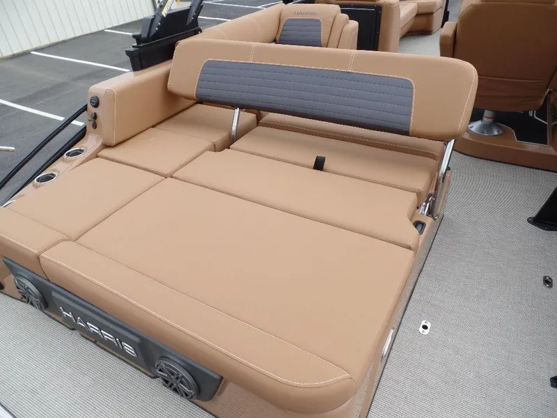 Slide: The Image of 2024 Harris Solstice 250 boat interior with tan seating and adjustable backrest. - 11