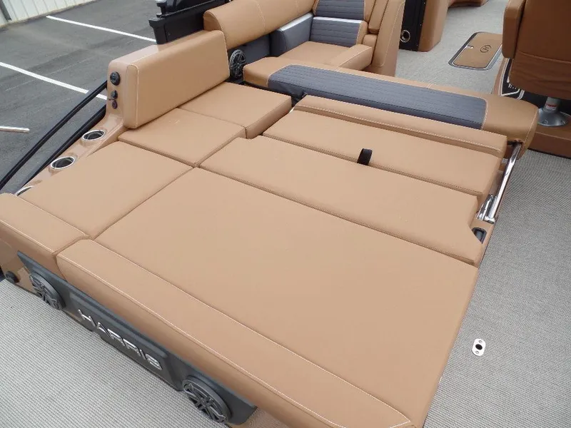 Slide: The Image of 2024 Harris Solstice 250 boat interior with tan leather seating and cup holders. - 13