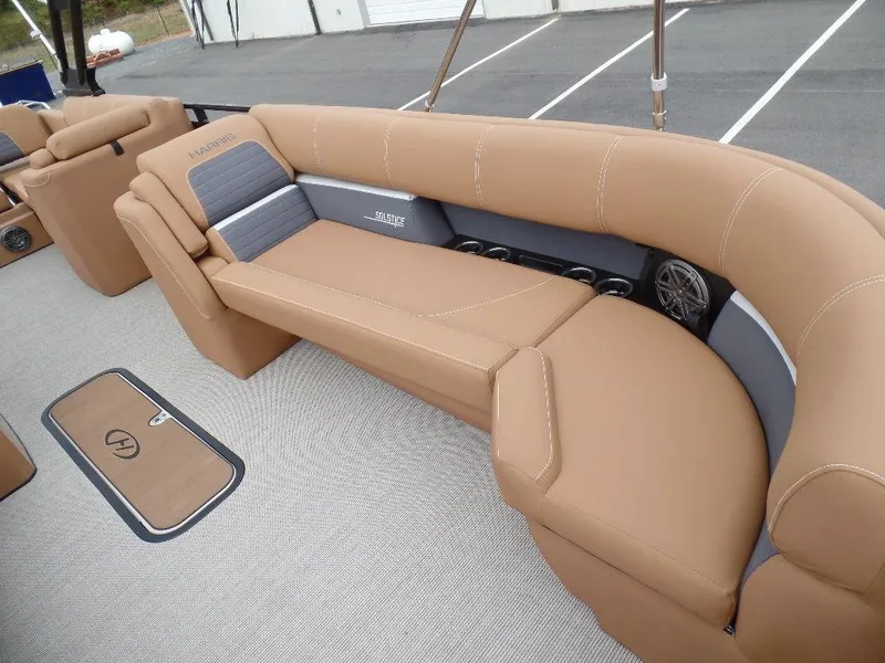 Slide: The Image of 2024 Harris Solstice 250 boat interior with tan seating and modern design. - 5