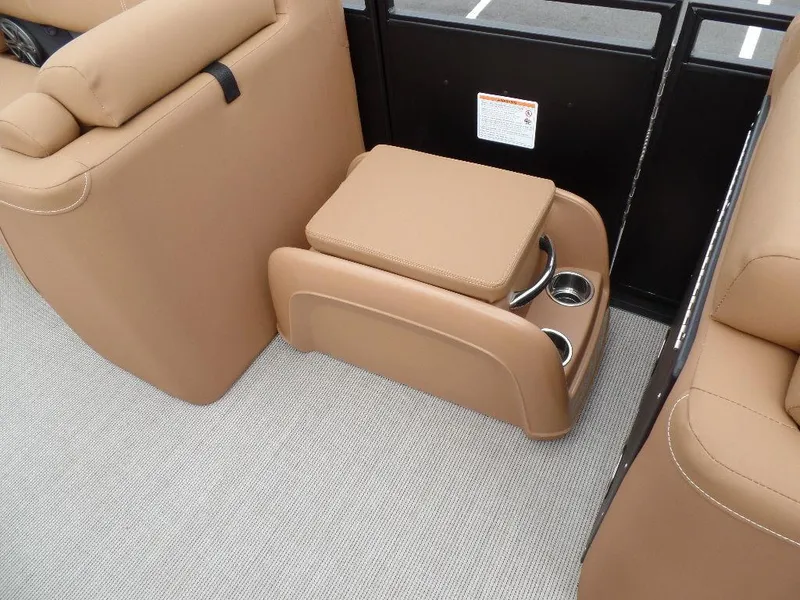 Slide: The Image of 2024 Harris Solstice 250 boat interior with tan seating and cup holders. - 6
