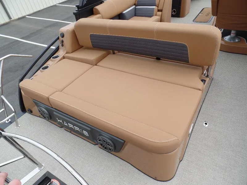 Slide: The Image of 2024 Harris Solstice 250 boat with tan seating and integrated speakers. - 9