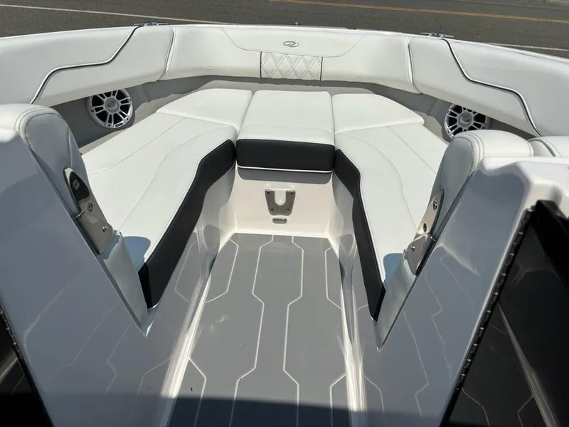 Slide: The Image of 2025 Regal LX6 boat interior with white and black seating. - 4