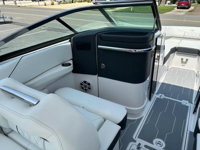 Slide: The Image of 2025 Regal LX6 boat interior with white leather seats and modern dashboard. - 5
