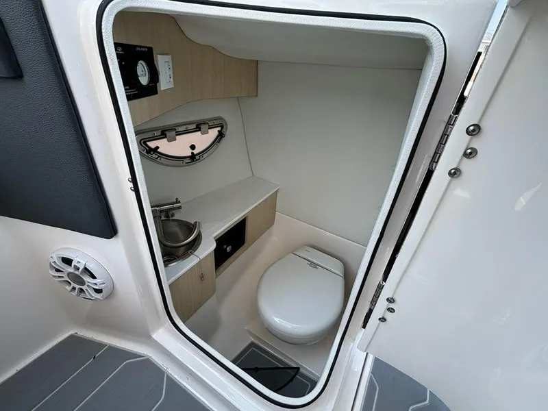 Slide: The Image of 2025 Regal LX6 boat interior bathroom with modern amenities. - 6