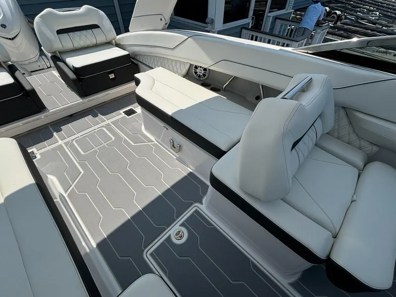Slide: The Image of 2025 Regal LX6 boat interior with white leather seating and modern design. - 7