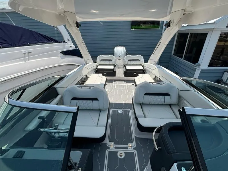 Slide: The Image of 2025 Regal LX6 boat interior with luxurious seating and modern design. - 8