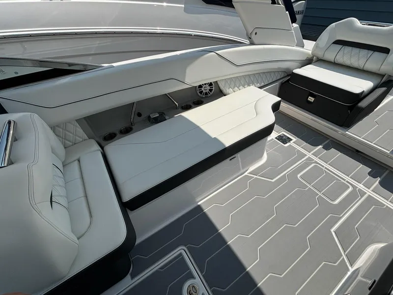 Slide: The Image of 2025 Regal LX6 boat interior with white leather seating and modern design. - 9