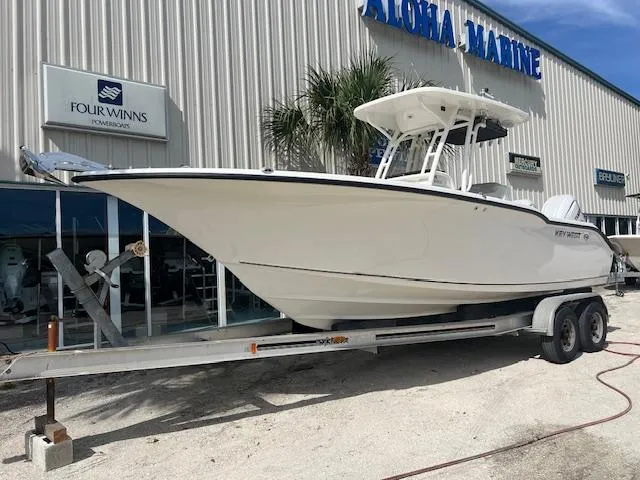 The Image of 2024 Key West 244 Center Console boat on trailer at Aloha Marine dealership. - 0