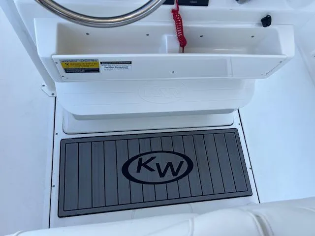 Slide: The Image of 2024 Key West 244 Center Console boat interior with KW logo mat. - 12