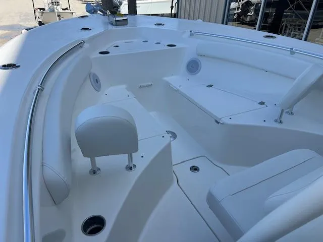 Slide: The Image of 2024 Key West 244 Center Console boat interior with seating and storage compartments. - 14