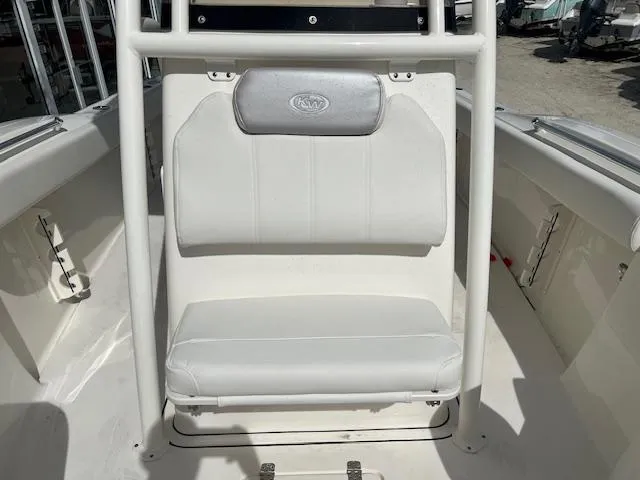 Slide: The Image of 2024 Key West 244 Center Console boat seating area with white cushioned seats. - 5