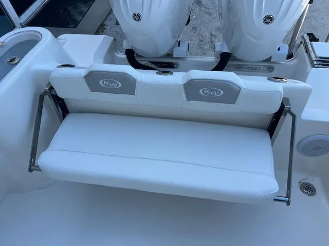 Slide: The Image of 2024 Key West 244 Center Console boat with foldable rear bench seat. - 8