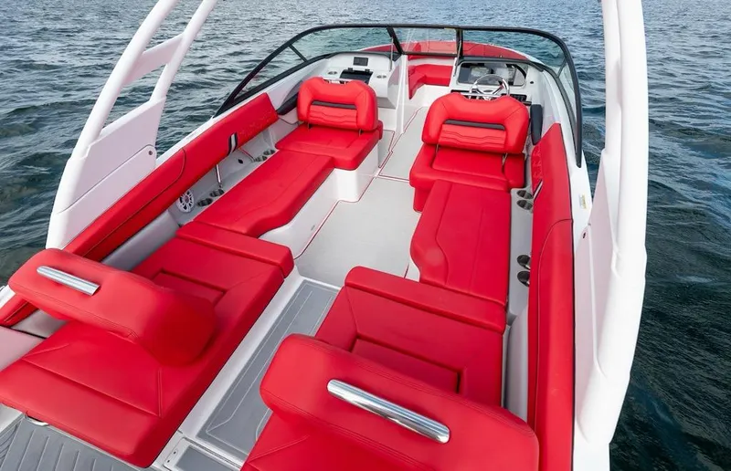 Slide: The Image of 2024 Regal LX9 boat with luxurious red seating on open water. - 12