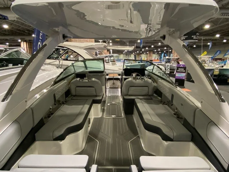Slide: The Image of 2024 Regal LX9 boat interior with spacious seating and modern design at a boat show. - 15