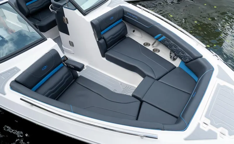 Slide: The Image of 2024 Regal LX9 boat interior with sleek black and blue seating, modern design. - 16