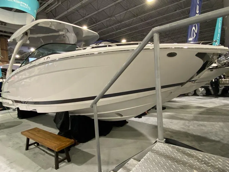 Slide: The Image of 2024 Regal LX9 boat displayed indoors, showcasing sleek design and modern features. - 8