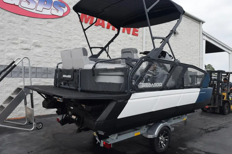 Slide: The Image of 2024 Sea-Doo Switch Sport 18 on trailer outside dealership. - 4